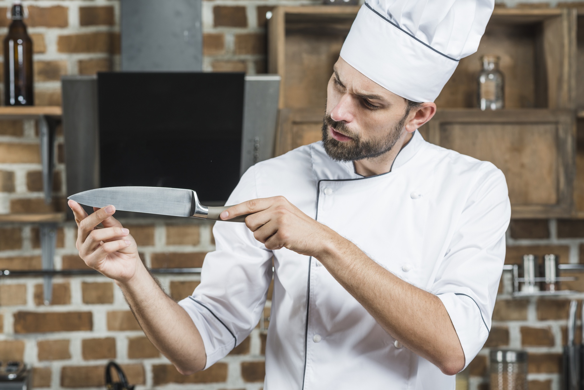 Author demonstrating knife skills in a studio kitchen